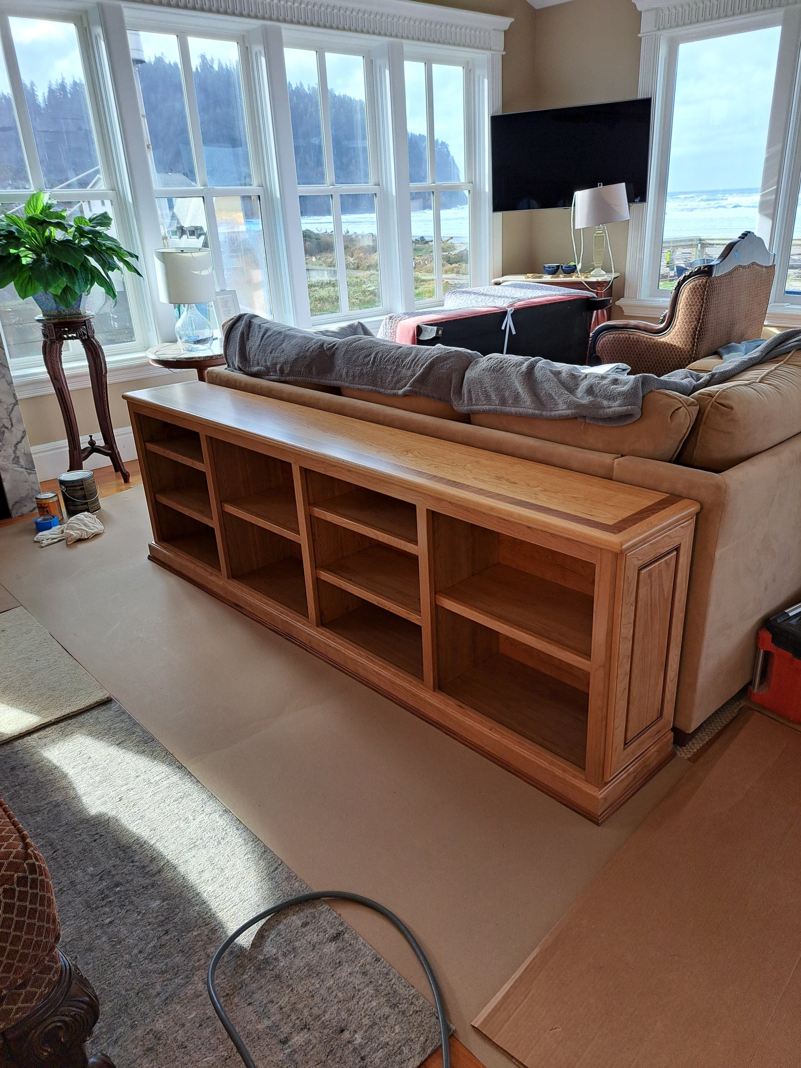 Sapele bookcase cabinet with open shelving set in place during installation