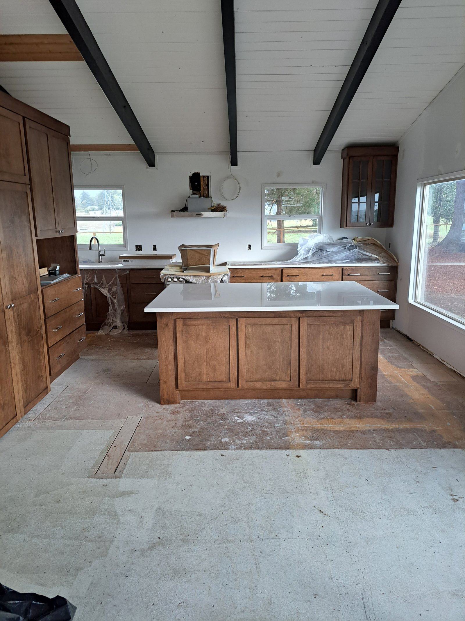 Maple kitchen cabinetry with finished countertops