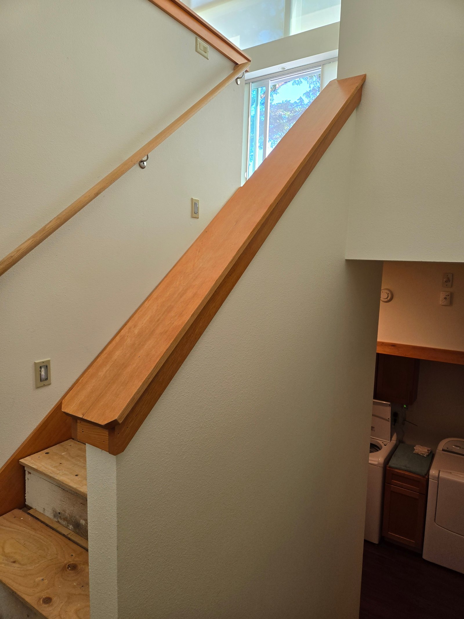 Two level staircase with custom finish