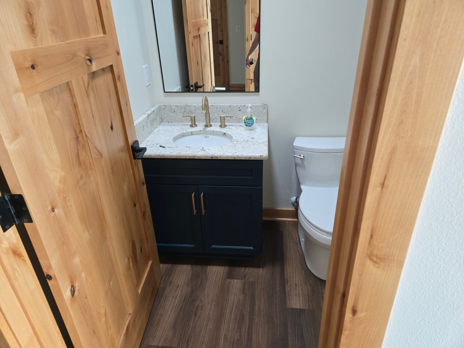 Custom blue bathroom vanity with granite countertop