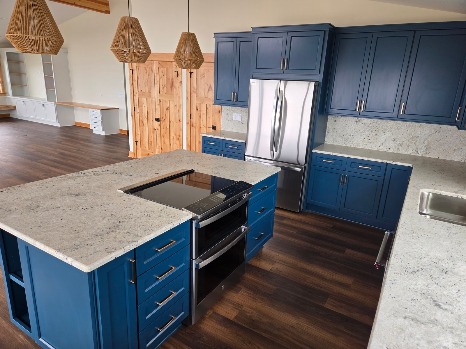 Kitchen island with stove oven and custom blue cabinets