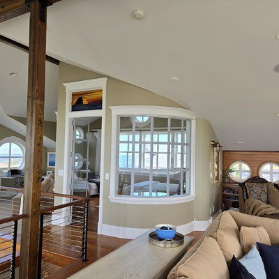 Casey Jay Winters Construction custom trim and finish work with bay window and porthole windows, Tillamook Oregon